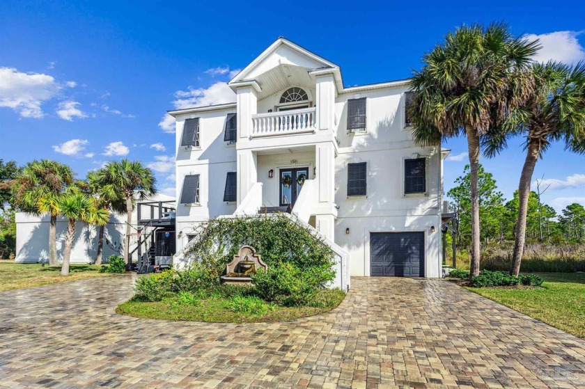 This mediterranian style home with Bahamian shutters is located - Beach Home for sale in Gulf Breeze, Florida on Beachhouse.com