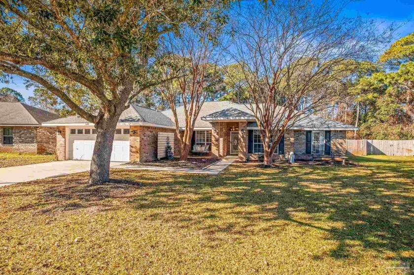 Priced below appraised value!! This contemporary brick home - Beach Home for sale in Gulf Breeze, Florida on Beachhouse.com