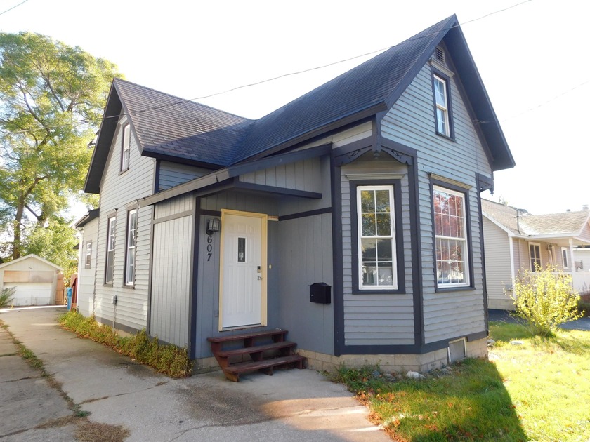 This charming Manistee starter home offers convenient - Beach Home for sale in Manistee, Michigan on Beachhouse.com