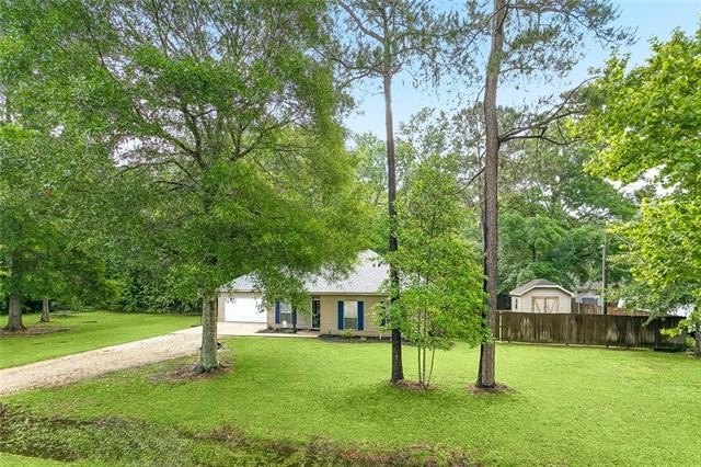 Welcome to 66132 Cypress St, a charming home nestled on a - Beach Home for sale in Mandeville, Louisiana on Beachhouse.com