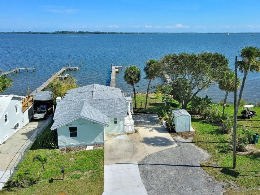 Discover a charming riverfront oasis with a 150' private dock on - Beach Home for sale in Micco, Florida on Beachhouse.com