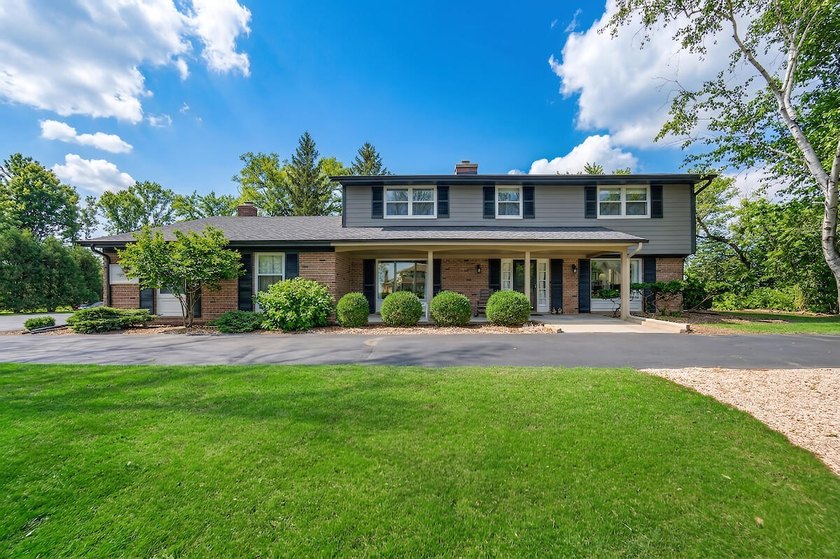 Enjoy scenic lake views from this beautifully situated 2-story - Beach Home for sale in Racine, Wisconsin on Beachhouse.com