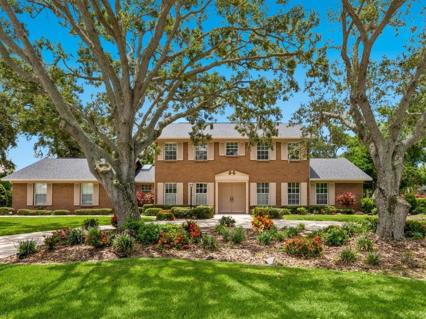 Nestled on a generous half-acre+ lot beneath majestic live oaks - Beach Home for sale in Sarasota, Florida on Beachhouse.com