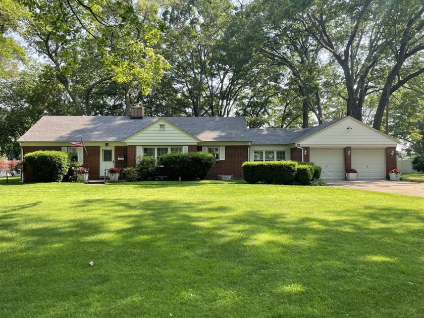 Wonderful classic 1950's ranch home by Mona Lake! Lovely woodsy - Beach Home for sale in Norton Shores, Michigan on Beachhouse.com