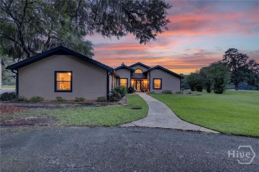 Nestled beneath 22 mature oak trees and surrounded by coastal - Beach Home for sale in Midway, Georgia on Beachhouse.com