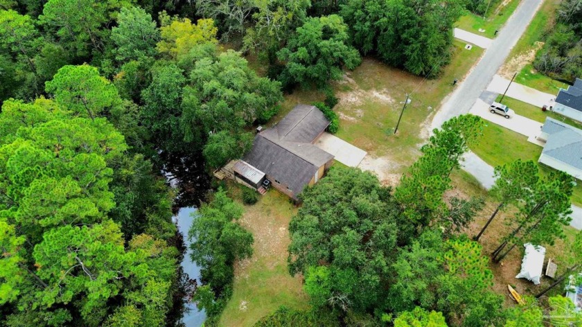 This single story, 3 bed, 2 full bath waterfront home on Mulat - Beach Home for sale in Milton, Florida on Beachhouse.com