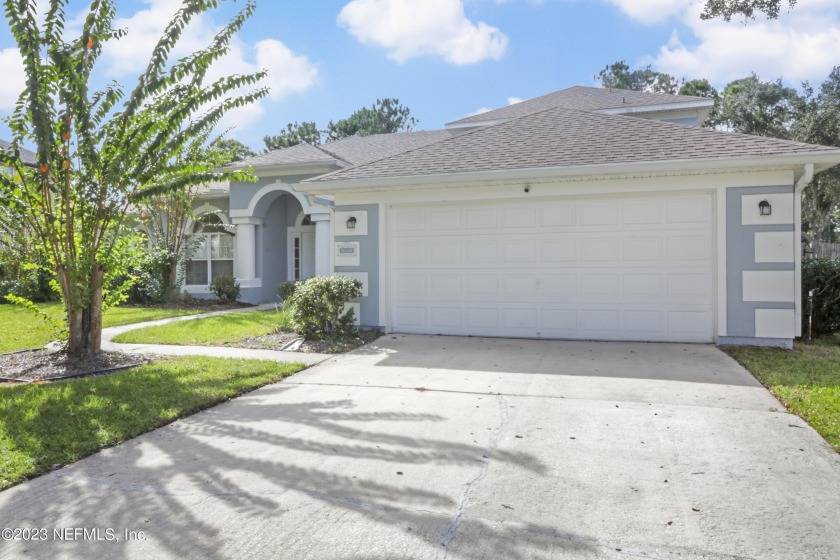 Welcome to this expansive 5-bedroom, 3-bathroom haven, nestled - Beach Home for sale in Saint Johns, Florida on Beachhouse.com
