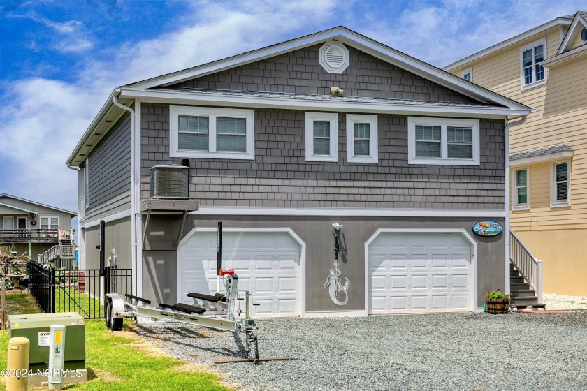 Welcome to ''Tarpon Time'' - your dream CANAL FRONT coastal - Beach Home for sale in Holden Beach, North Carolina on Beachhouse.com