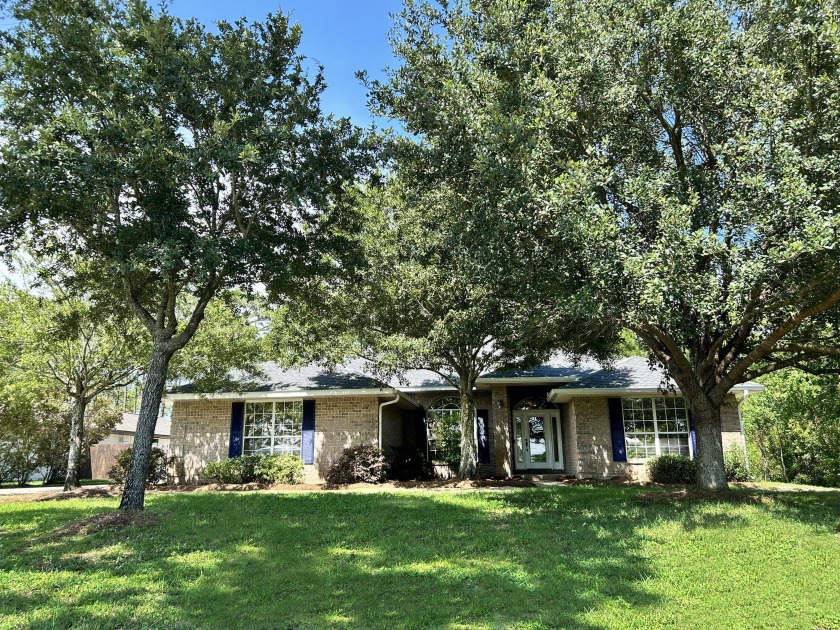 Welcome to this 4-bedroom, 2-bathroom brick home in the coveted - Beach Home for sale in Santa Rosa Beach, Florida on Beachhouse.com