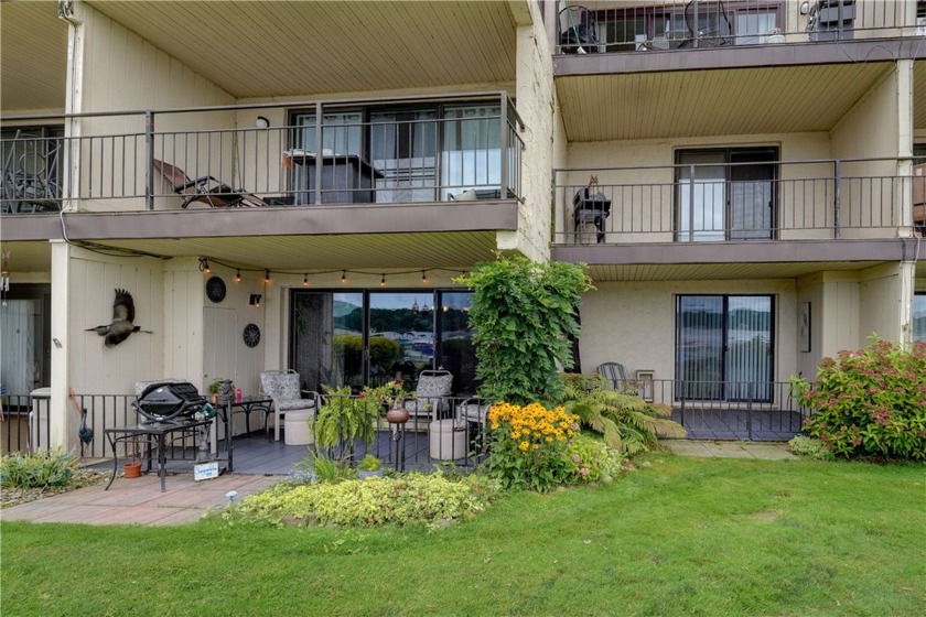 Comfort & convenience with a beautiful waterfront setting! This - Beach Condo for sale in Irondequoit, New York on Beachhouse.com