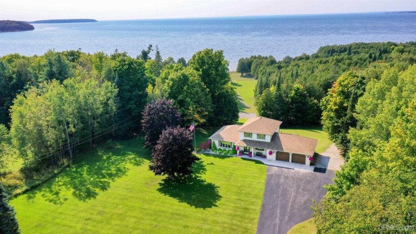 Sitting comfortably on a sprawling 6.8 acre waterfront parcel - Beach Home for sale in Garden, Michigan on Beachhouse.com