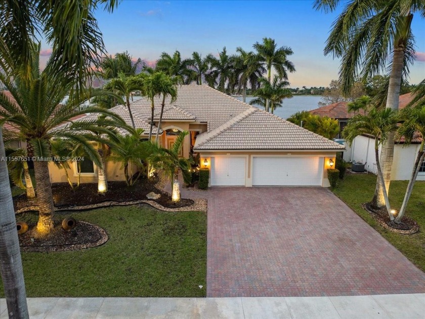 Stunning home overlooking a grand lake in the gated community of - Beach Home for sale in Miramar, Florida on Beachhouse.com