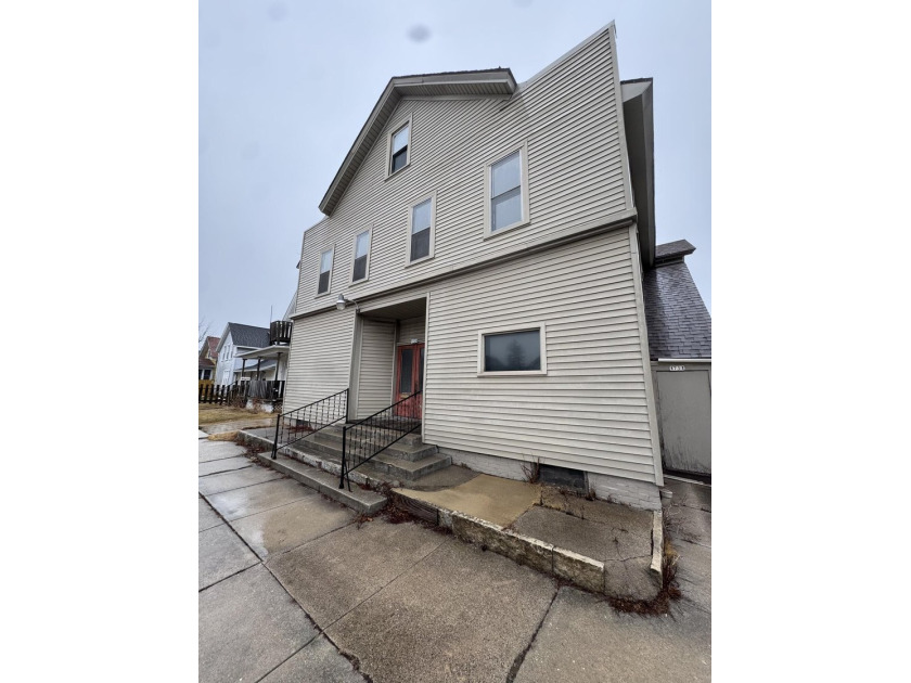 Corner mixed-use opportunity featuring four 2BR/1BA residential - Beach Lot for sale in Sheboygan, Wisconsin on Beachhouse.com
