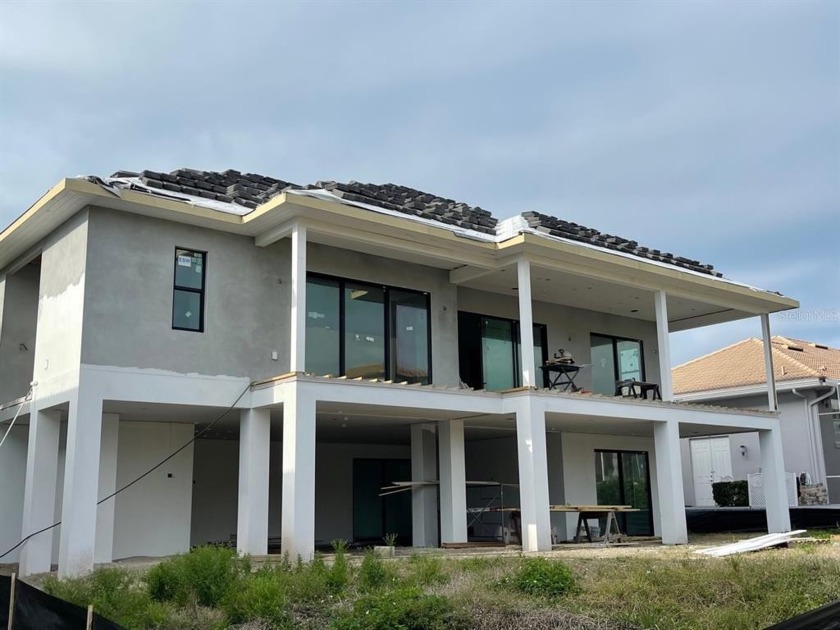 Under Construction. Gorgeous new canal front home located behind - Beach Home for sale in Cortez, Florida on Beachhouse.com