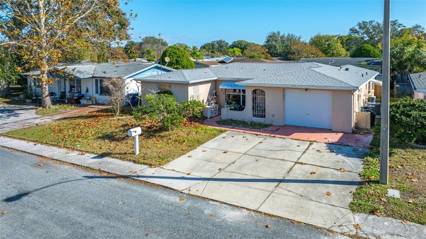 Welcome to this spacious 3-bedroom, 2-bath home featuring a - Beach Home for sale in Port Richey, Florida on Beachhouse.com