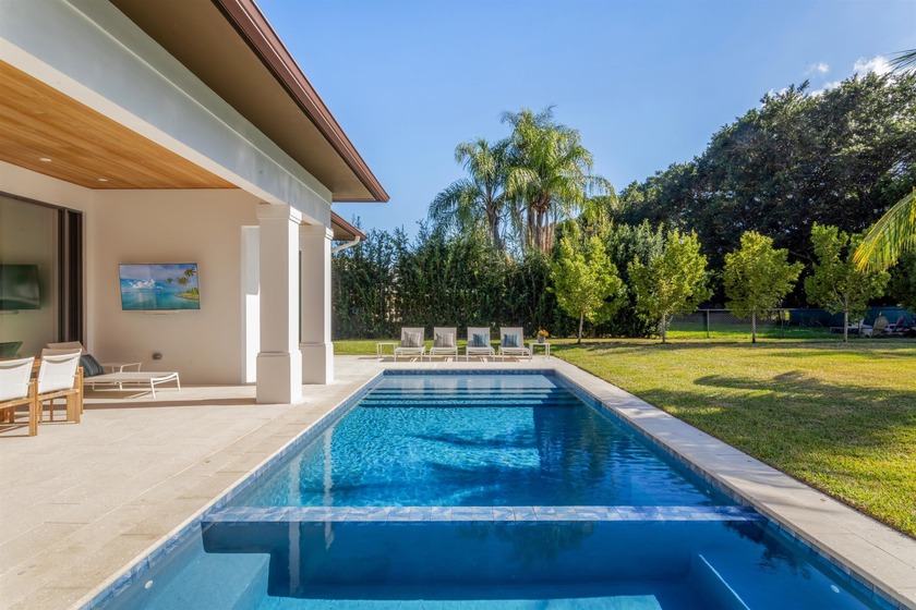 Exquisitely situated on the first tee of the private Dutchman's - Beach Home for sale in West Palm Beach, Florida on Beachhouse.com