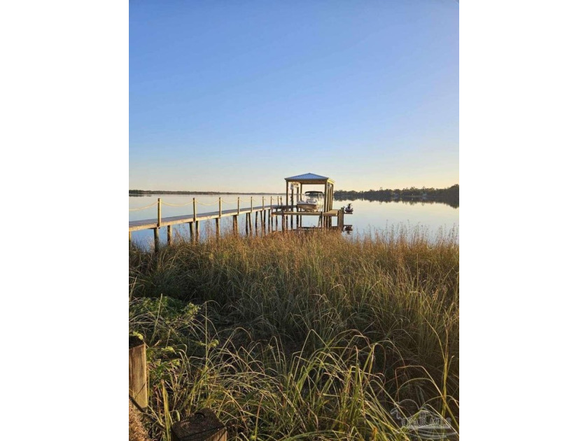 Waterfront Cottage with Covered Boat Lift, Jet ski Lift, and Two - Beach Home for sale in Milton, Florida on Beachhouse.com