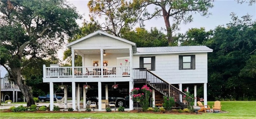 Adorable, Raised Cottage with fabulous amenities. Located just - Beach Home for sale in Gulf Shores, Alabama on Beachhouse.com
