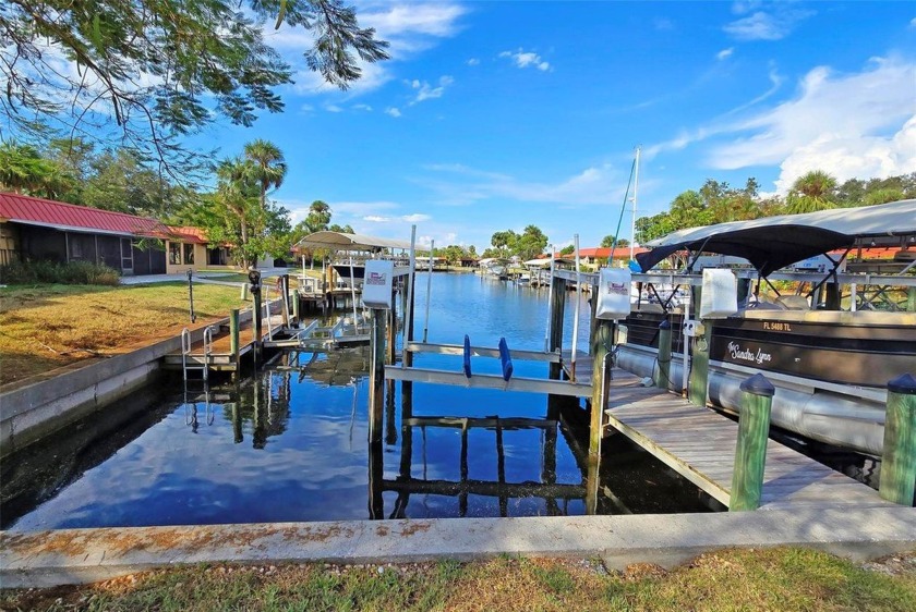 WATERFRONT with private dock and lift! This charming canal front - Beach Home for sale in Bradenton, Florida on Beachhouse.com