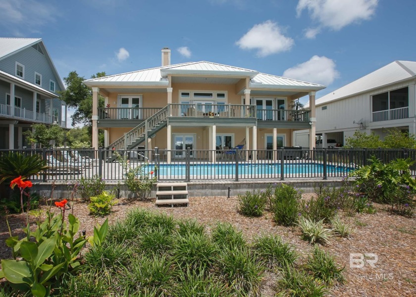 GORGEOUS VIEWS come with this BEAUTIFUL WATERFRONT HOME and - Beach Home for sale in Orange Beach, Alabama on Beachhouse.com