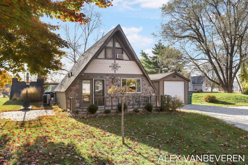 Nestled on the shores of Lake Marie, a stones throw from Silver - Beach Home for sale in Mears, Michigan on Beachhouse.com