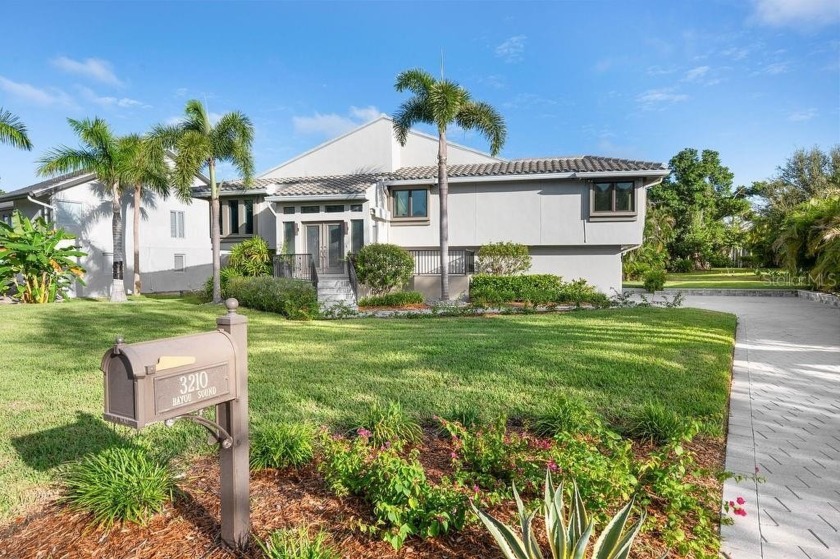 Welcome to this elevated retreat in the sought-after Bayou - Beach Home for sale in Longboat Key, Florida on Beachhouse.com