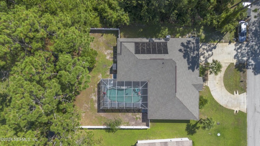 This beautiful 4-bedroom, 2-bath pool home is move-in ready with - Beach Home for sale in Palm Coast, Florida on Beachhouse.com