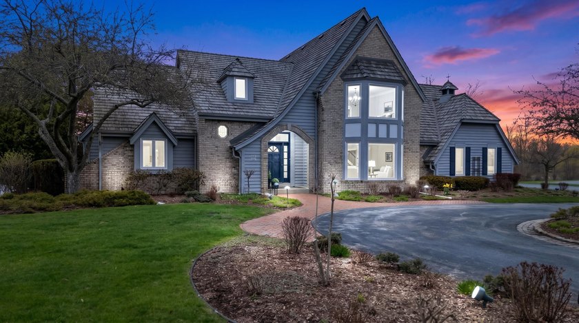 Tucked on a quiet cul-de-sac and set on a beautiful pond, this - Beach Home for sale in Mequon, Wisconsin on Beachhouse.com