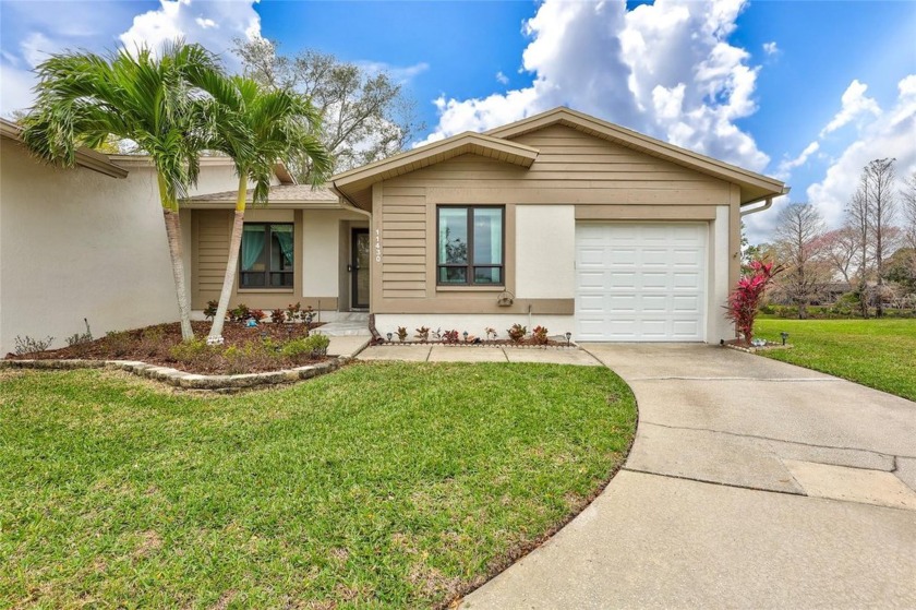 Spacious End-Unit Villa with Water Views! Tucked away in a quiet - Beach Home for sale in Largo, Florida on Beachhouse.com