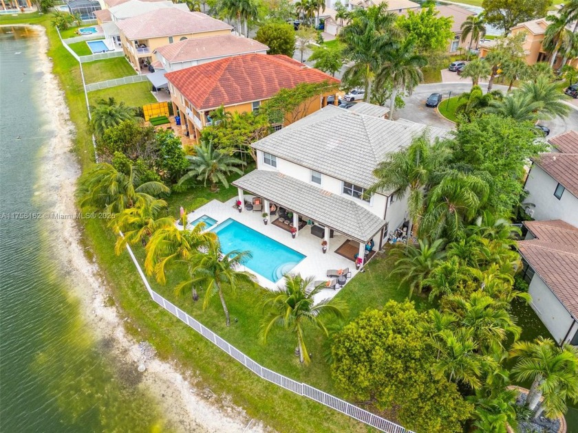 Exquisite two-story estate offers breathtaking lake views! - Beach Home for sale in Miramar, Florida on Beachhouse.com