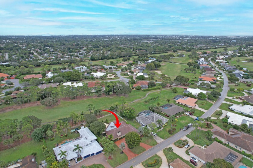 Set on an oversized .52-acre lot overlooking the public  golf - Beach Home for sale in Atlantis, Florida on Beachhouse.com