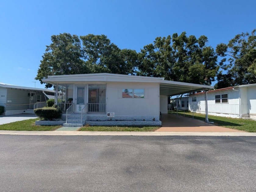 Welcome home to this lovely 2 bedroom 2 bath double wide located - Beach Home for sale in Clearwater, Florida on Beachhouse.com