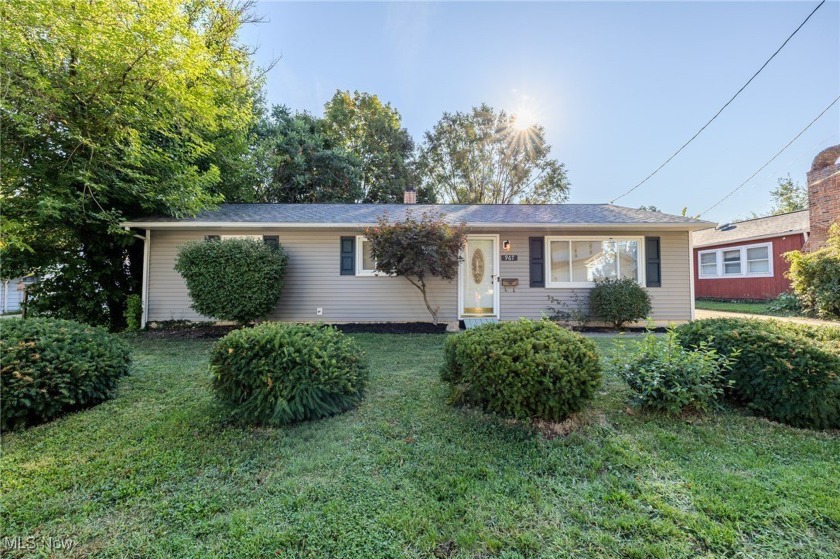Nestled in a serene neighborhood near a tranquil lakeside, this - Beach Home for sale in Willoughby, Ohio on Beachhouse.com