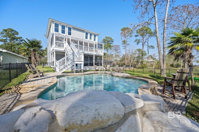 Welcome to your waterfront oasis with this Bayfront Home - Beach Home for sale in Lillian, Alabama on Beachhouse.com