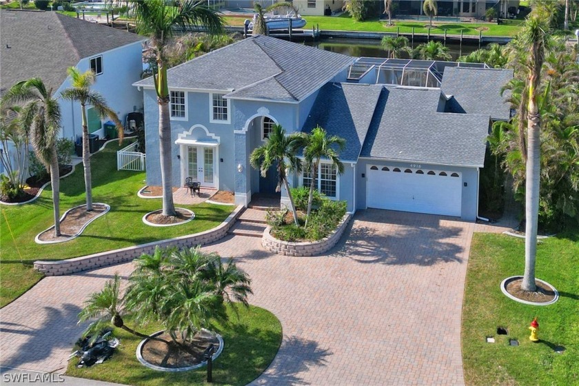 This Tuscan-style home is located in the highly sought-after SW - Beach Home for sale in Cape Coral, Florida on Beachhouse.com