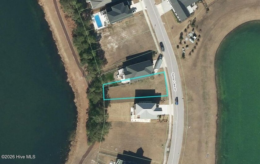 Set along the quiet shoreline of Spicer Lake, this lake front - Beach Lot for sale in Holly Ridge, North Carolina on Beachhouse.com