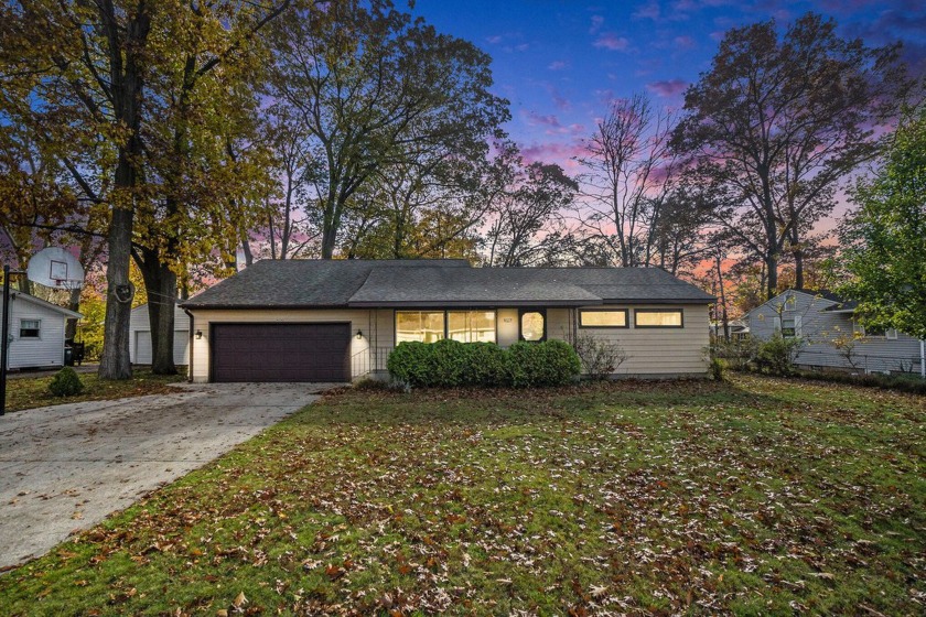 This well-maintained ranch home is sitting on a tree-lined - Beach Home for sale in Muskegon, Michigan on Beachhouse.com