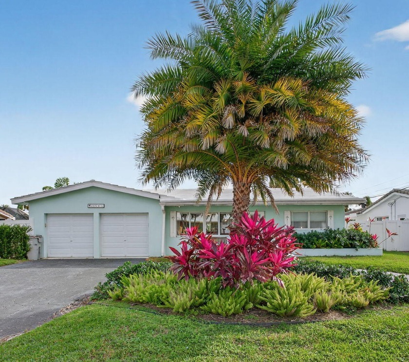 This beautifully updated 3-bedroom, 2-bath canal-front home - Beach Home for sale in Pompano Beach, Florida on Beachhouse.com