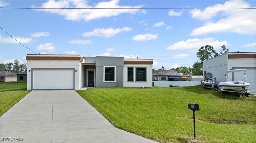 PRICE ADJUSTMENT!! This 2024-built home blends clean, modern - Beach Home for sale in Lehigh Acres, Florida on Beachhouse.com