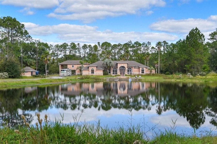 Welcome to your serene 4.5-acre gated country estate, a true - Beach Home for sale in Ormond Beach, Florida on Beachhouse.com