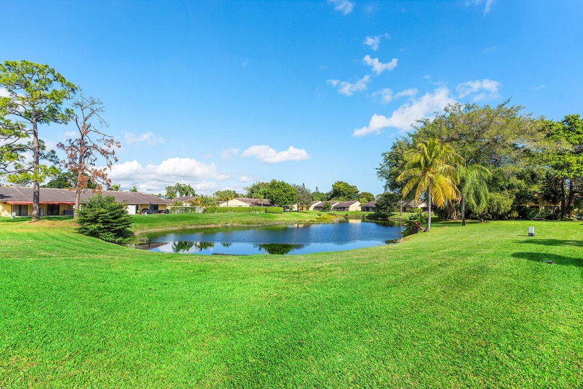 Wake up to tranquil lake views in this fully renovated - Beach Home for sale in Boca Raton, Florida on Beachhouse.com