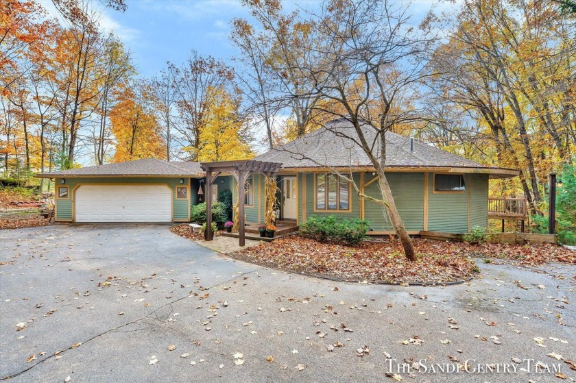 Introducing a unique circular walkout ranch with over 3,800 sq - Beach Home for sale in Spring Lake, Michigan on Beachhouse.com