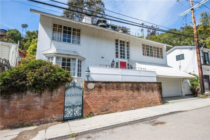 Tucked away in Rustic Canyon, this classic Santa Monica home is - Beach Home for sale in Santa Monica, California on Beachhouse.com