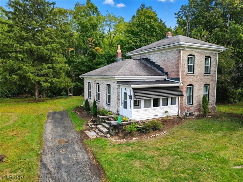 This beautifully updated brick colonial sits on nearly 0.70 - Beach Home for sale in Geneva, Ohio on Beachhouse.com