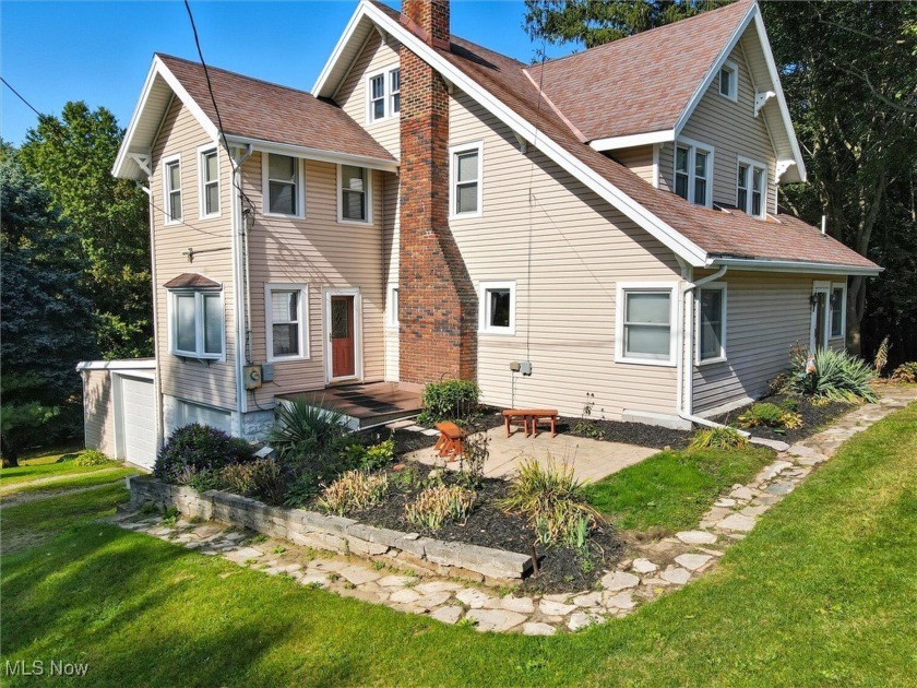 Nestled on a scenic hillside, this charming Colonial offers the - Beach Home for sale in Geneva, Ohio on Beachhouse.com