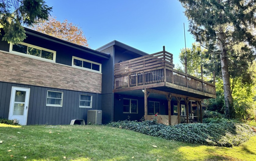 Welcome to your ~3,000sf midcentury refuge! Short ~4min walk to - Beach Home for sale in Coloma, Michigan on Beachhouse.com