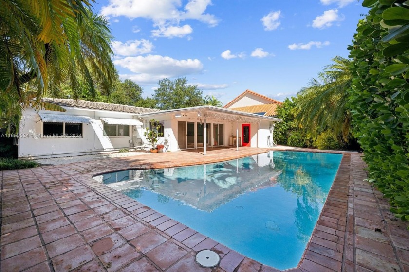 Impeccably maintained 4-bedroom, 2 1/2 -bathroom home nestled on - Beach Home for sale in Key Biscayne, Florida on Beachhouse.com