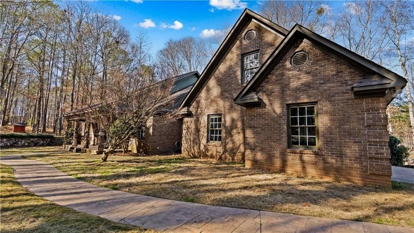 Set behind a paved entrance with brick columns, this inviting - Beach Home for sale in Other, Georgia on Beachhouse.com