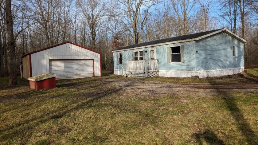 This 3 bed 2 bath modular home sits on 5 wooded acres with a - Beach Home for sale in Free Soil, Michigan on Beachhouse.com