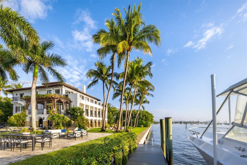 Perfectly set on a  1/2  acre +, bayfront estate, this 3-story - Beach Home for sale in Miami, Florida on Beachhouse.com
